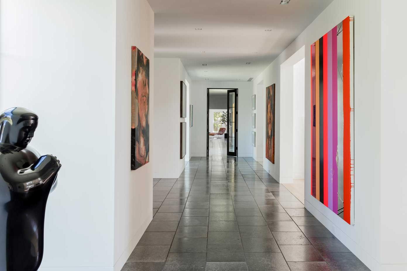 hallway with art along the walls